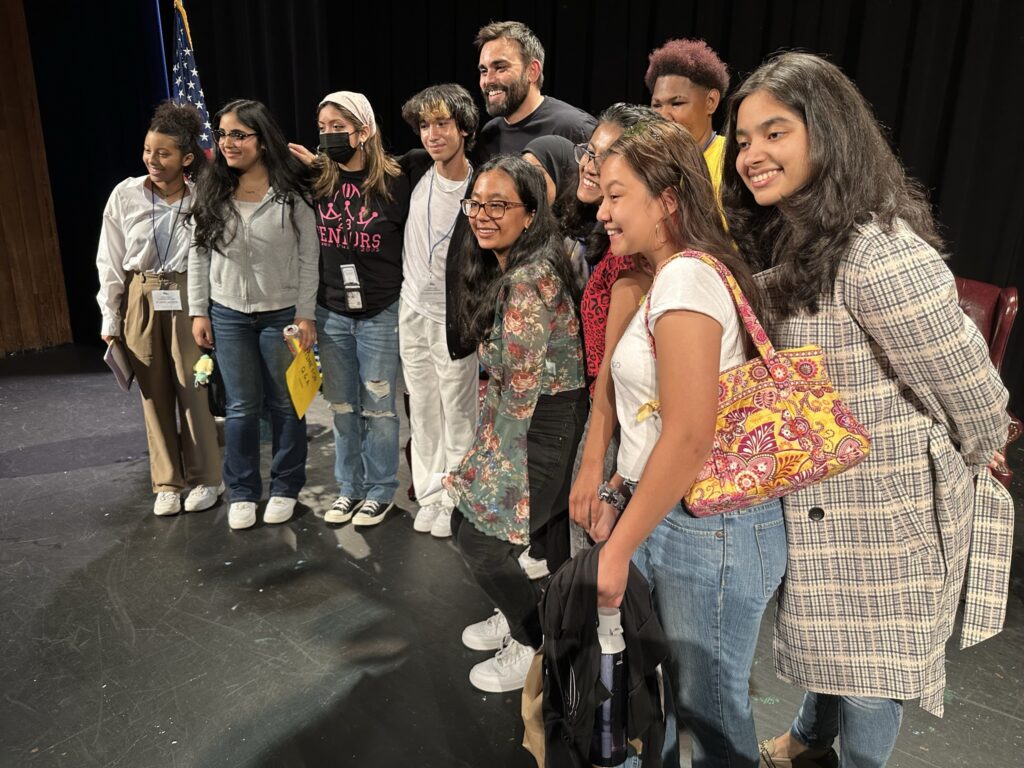 Michelle (third from left) and a group of Lewis High School students pose with Andrew Aydin - September 27, 2022